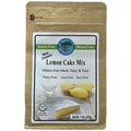 A 11 oz bag of Authentic Foods Lemon Cake Mix in a brown kraft paper stand-up pouch with a white and green front label.