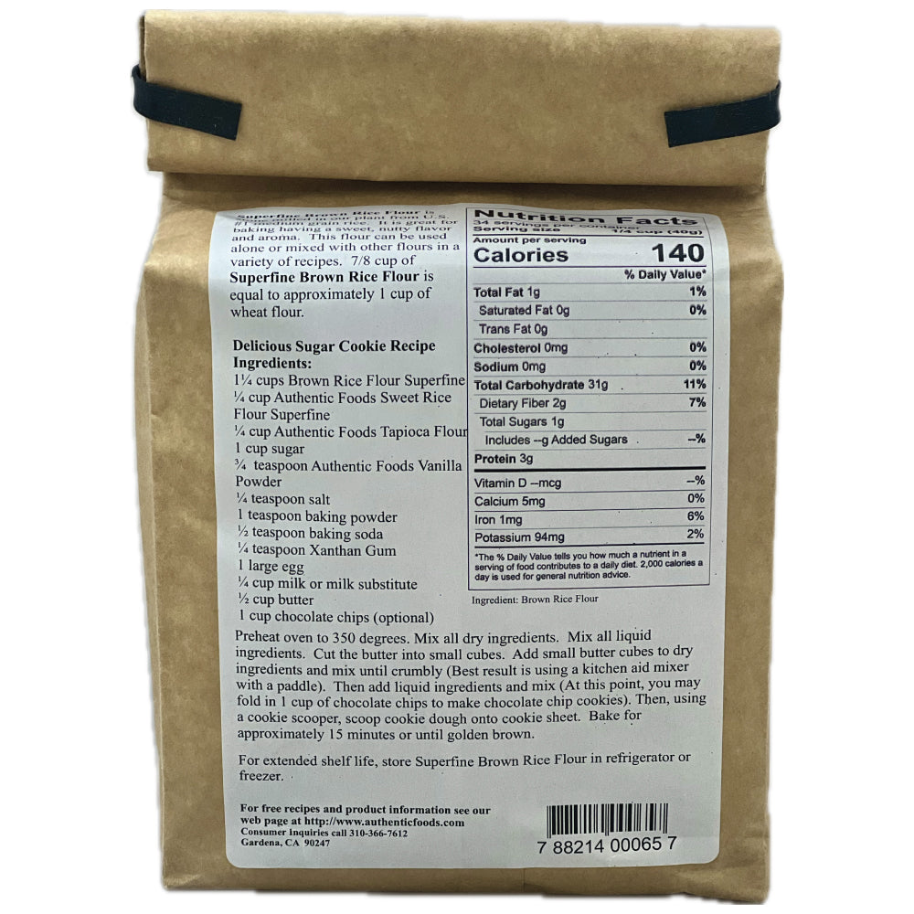 Back side of a kraft paper bag showing a nutrition facts label for Superfine Brown Rice Flour 3lbs, with a brown paper roll partially visible behind it on a white background.