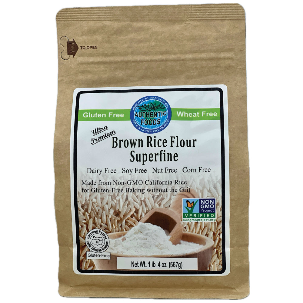 A 1.25 lb bag of Authentic Foods Brown Rice Flour Superfine, in a brown kraft paper bag with a large white and green label, on a white background.