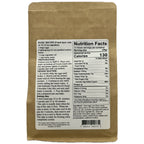 The back of a kraft paper bag of the Authentic Foods Devil Chocolate Cake Mix. It showis a large white printed nutrition facts label and recipe text for the chocolate cake.