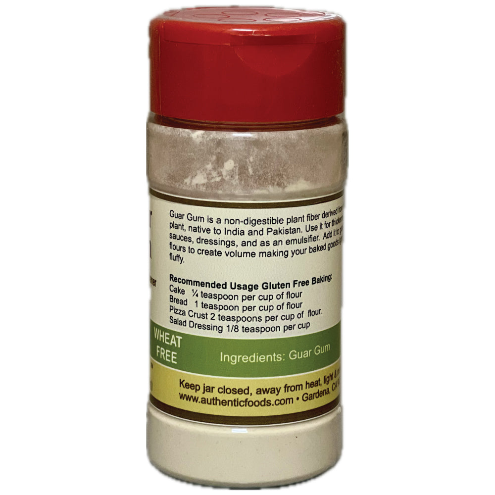 A plastic shaker bottle of Guar Gum flour, featuring a red cap and a white label with green and yellow text detailing its use in gluten-free baking.