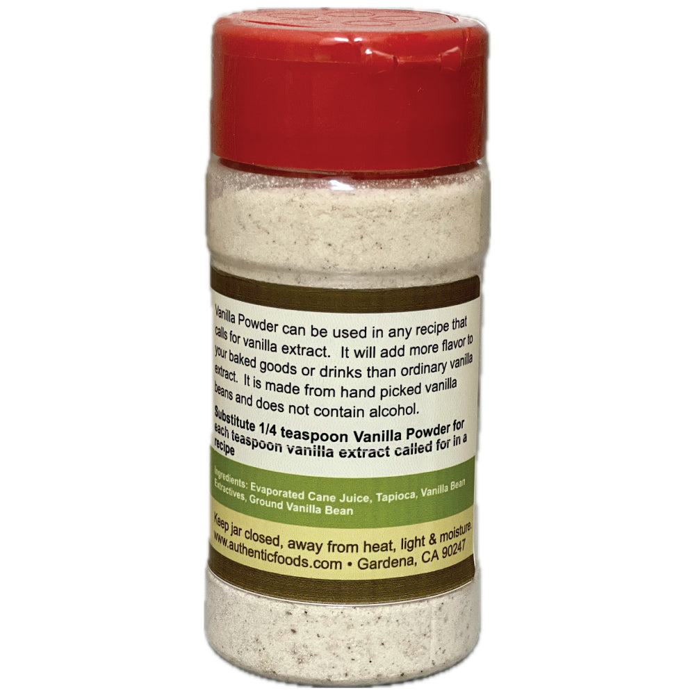 A clear plastic jar of vanilla powder with a red screw-on lid and a white label featuring brown and green text, shown on a white background.